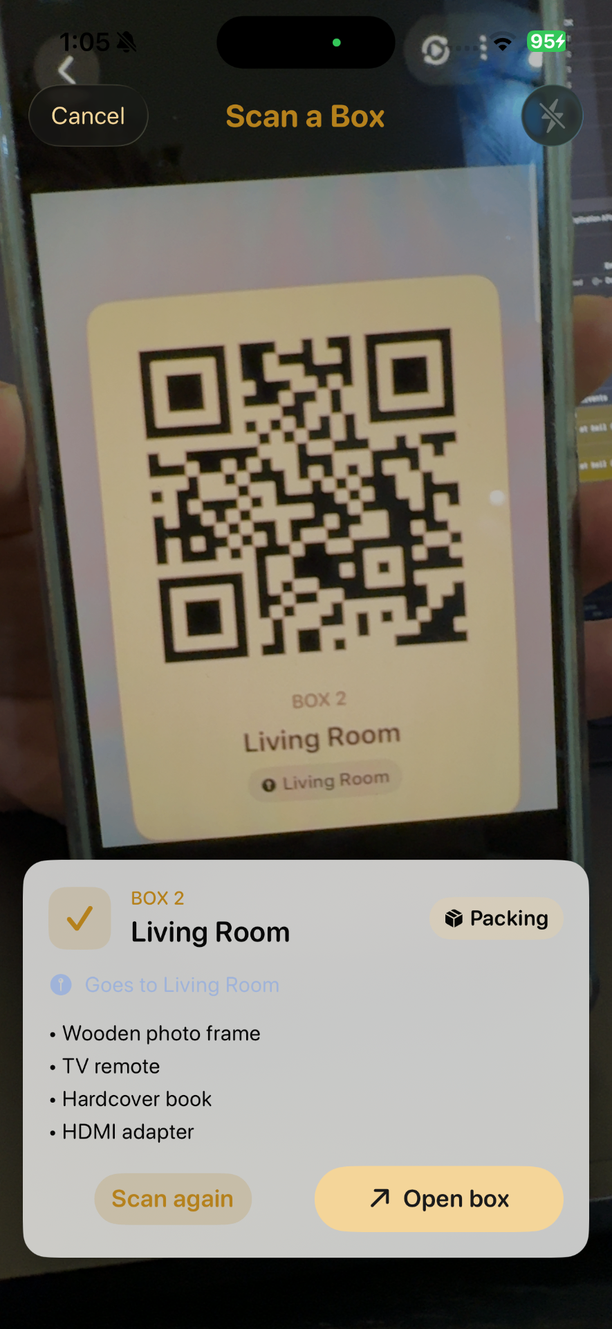 Scanning a QR label on a moving box, showing Box 2 Living Room contents preview